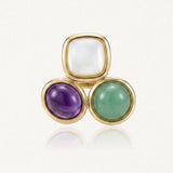 Bague en acier inoxydable doré avec trois cabochons de résine colorée : blanc carré, violet ovale, et vert rond.