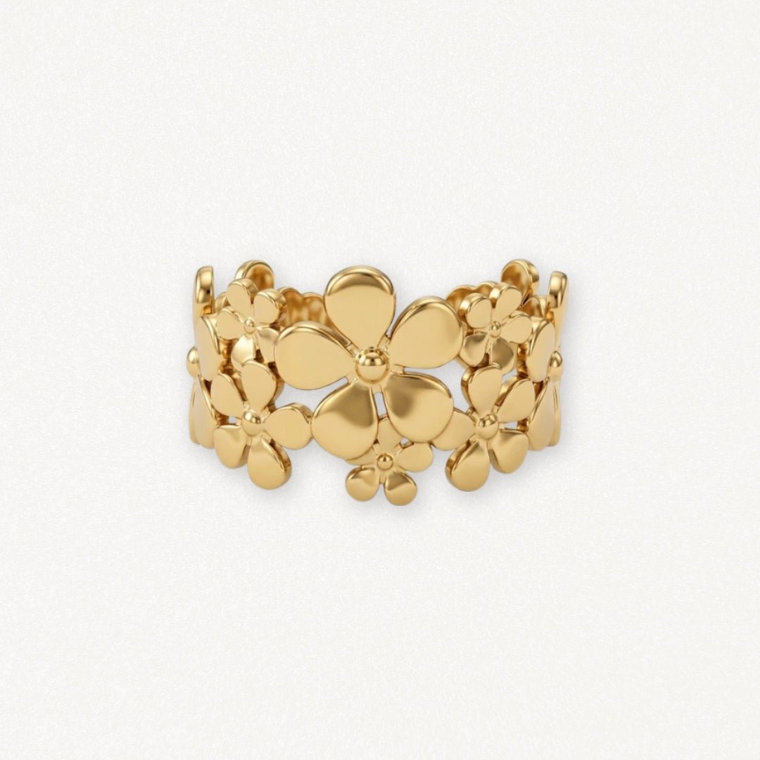 Bague en acier inoxydable doré, motif floral avec des fleurs de différentes tailles polies et interconnectées.
