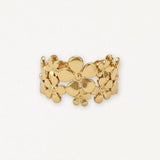 Bague en acier inoxydable doré, motif floral avec des fleurs de différentes tailles polies et interconnectées.