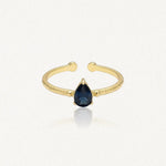 Bague Leandra ouverte en acier inoxydable doré avec une pierre bleue en forme de goutte au centre