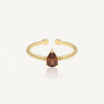 Bague Leandra en acier inoxydable doré avec une pierre marron en forme de goutte et un anneau à la texture martelée