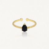 Bague Leandra en acier inoxydable doré avec une pierre noire en forme de goutte et un anneau à la texture martelée