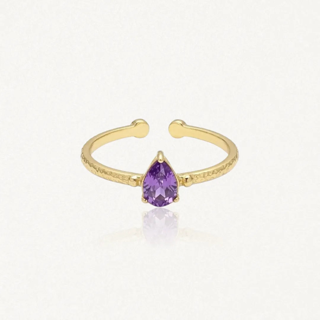 Bague Leandra ajustable en acier inoxydable doré avec une pierre violette en forme de goutte