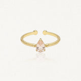 Bague Leandra ouverte en acier inoxydable doré avec une pierre rose en forme de goutte au centre