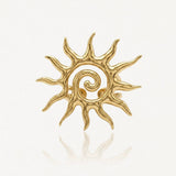 Bague ajustable en acier inoxydable doré, motif soleil stylisé avec spirale centrale.
