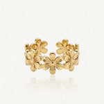 Bague ajustable en acier inoxydable doré, ornée de six fleurs à six pétales et cœur en relief.