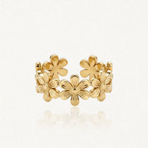 Bague ajustable en acier inoxydable doré, ornée de six fleurs à six pétales et cœur en relief.