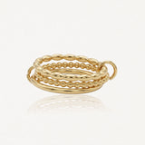 Bague multirangs en acier inoxydable doré, 5 anneaux aux textures variées: lisses, perlés et ovales, reliés