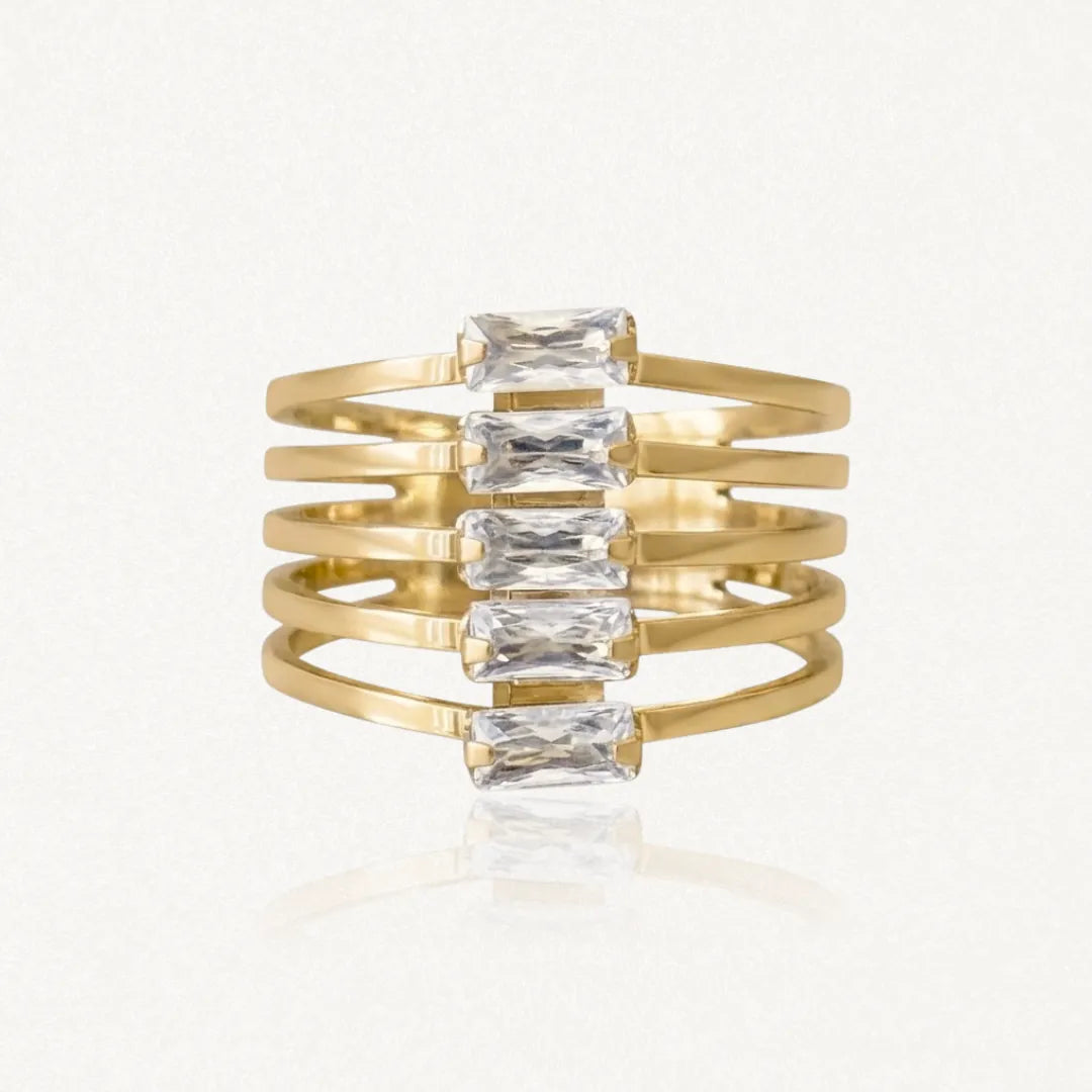 Bague manchette multirangs en acier inoxydable doré, ornée de cinq pierres baguette en Zirconium.