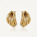 Paire de boucles d'oreilles en acier inoxydable doré, composées de 4 arcs tubulaires bombés et empilés.