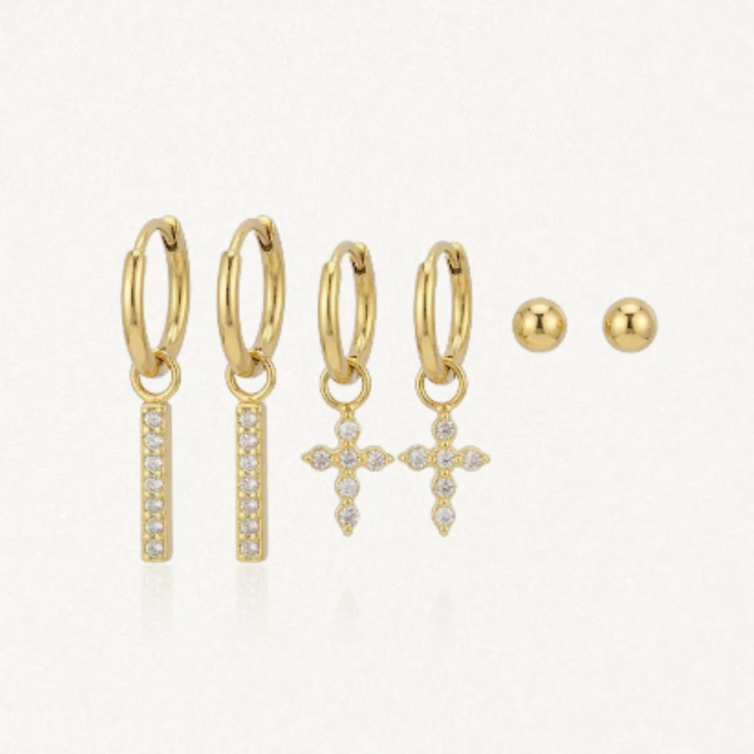 Trio de boucles d'oreilles en acier inoxydable doré: créoles barrettes zirconium, créoles croix zirconium et puces billes.