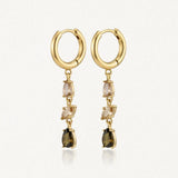 Boucles d'oreilles créoles pendantes en acier inoxydable doré, avec une cascade de zircons champagne et marron.