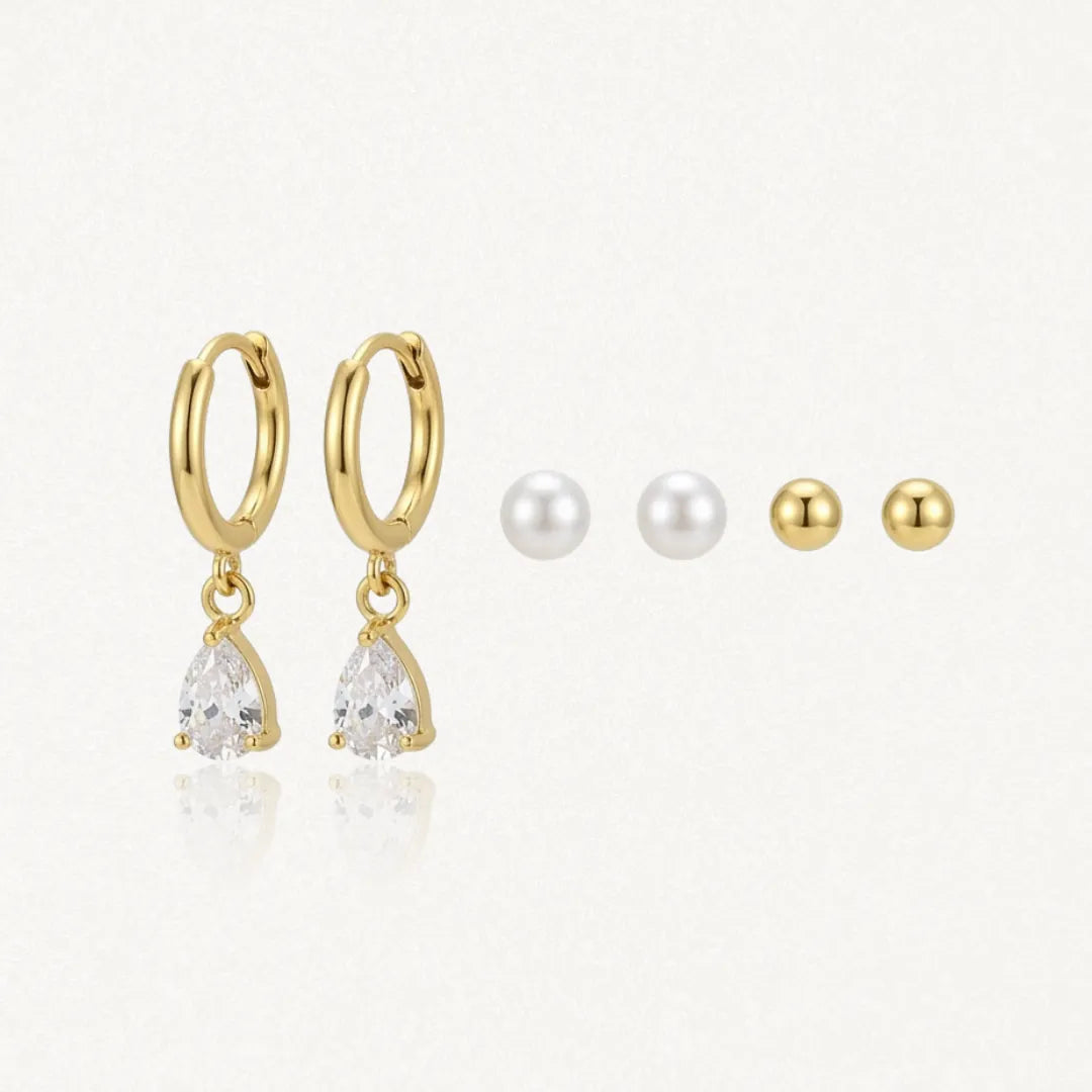 Trio de boucles d'oreilles: créoles acier inoxydable doré avec zirconium poire, puces perles et puces acier inoxydable doré.