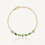 Bracelet Blair en acier inoxydable doré orné de plusieurs strass de tailles et de nuances de vert variées