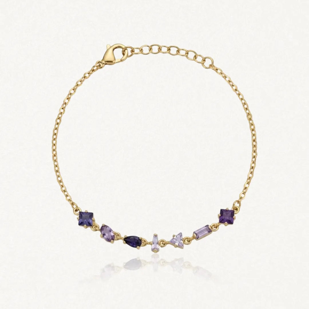 Bracelet Blair en acier inoxydable doré orné de six strass zircon aux nuances de violet de formes variées