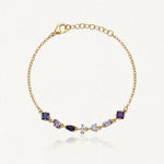 Bracelet Blair en acier inoxydable doré orné de six strass zircon aux nuances de violet de formes variées