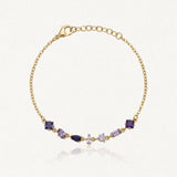 Bracelet Blair en acier inoxydable doré orné de six strass zircon aux nuances de violet de formes variées