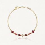 Bracelet Blair en acier inoxydable doré orné de strass rouges et roses de différentes formes géométriques