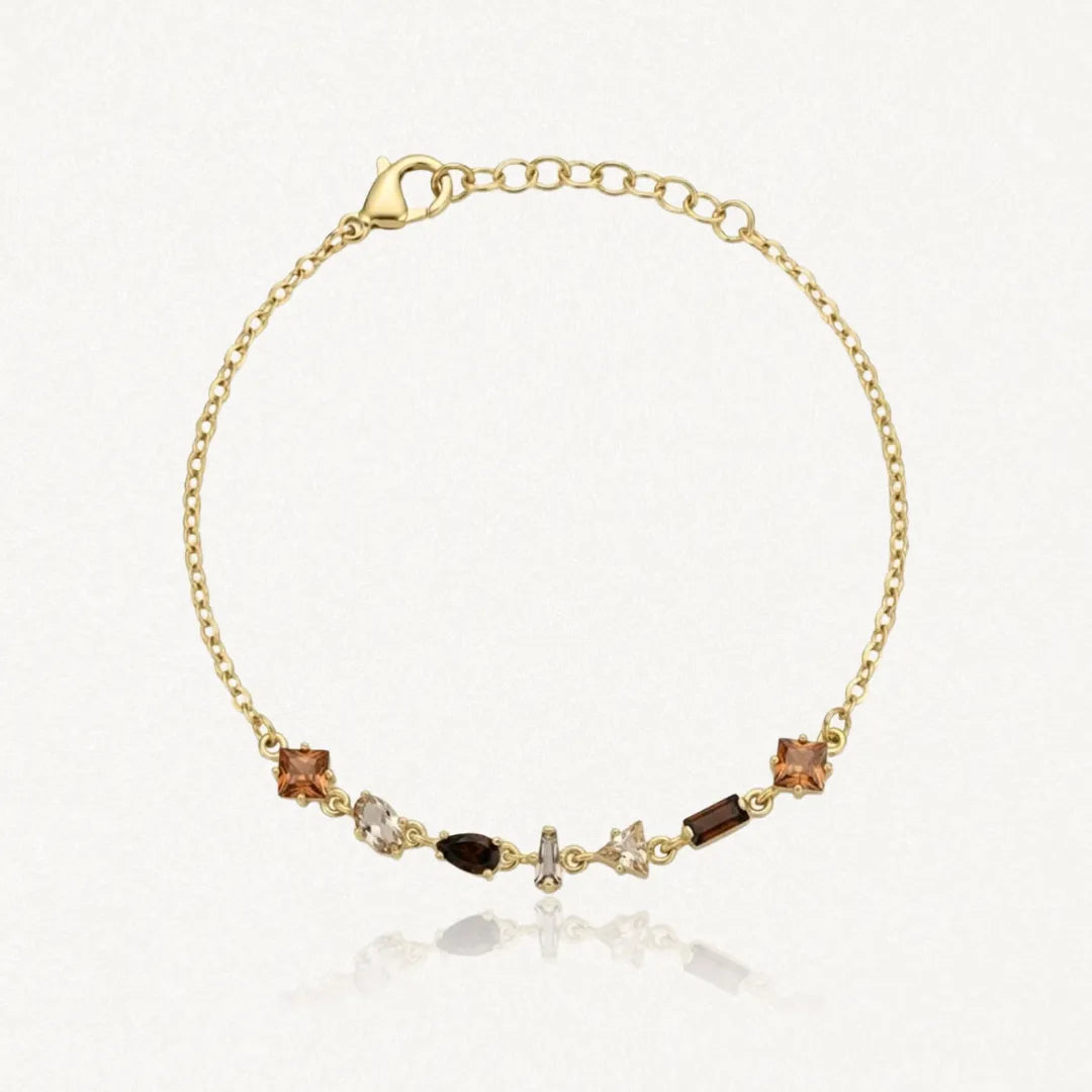 Bracelet Blair en acier inoxydable doré, orné de petits strass aux teintes brunes et ambrées