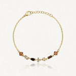 Bracelet Blair en acier inoxydable doré, orné de petits strass aux teintes brunes et ambrées
