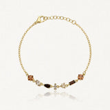 Bracelet Blair en acier inoxydable doré, orné de petits strass aux teintes brunes et ambrées