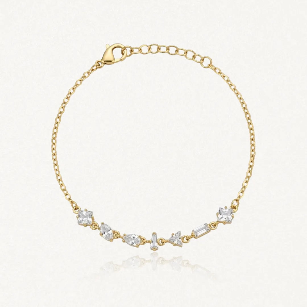 Bracelet Blair en acier inoxydable doré orné de plusieurs strass en zirconium de formes variées sur la chaîne