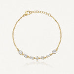 Bracelet Blair en acier inoxydable doré orné de plusieurs strass en zirconium de formes variées sur la chaîne