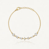 Bracelet Blair en acier inoxydable doré orné de plusieurs strass en zirconium de formes variées sur la chaîne
