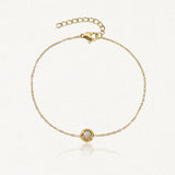 Bracelet fin en acier inoxydable dore avec un rond de pierre naturelle en Jade Blanc serti et chaînette réglable.