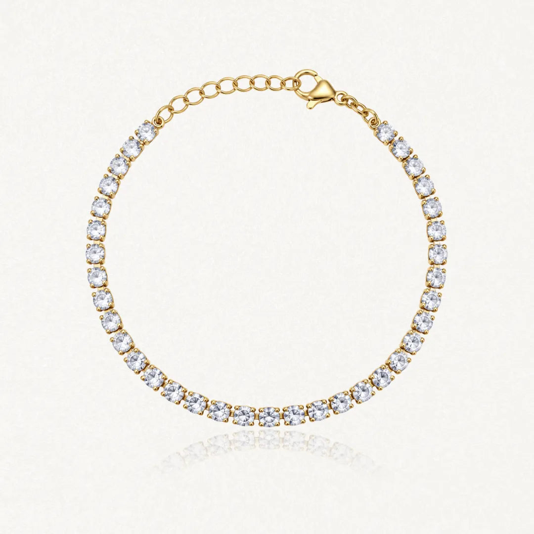 Bracelet tennis en acier inoxydable doré, entièrement serti de zircons blancs, avec chaînette d'extension et fermoir