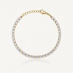 Bracelet tennis en acier inoxydable doré, entièrement serti de zircons blancs, avec chaînette d'extension et fermoir