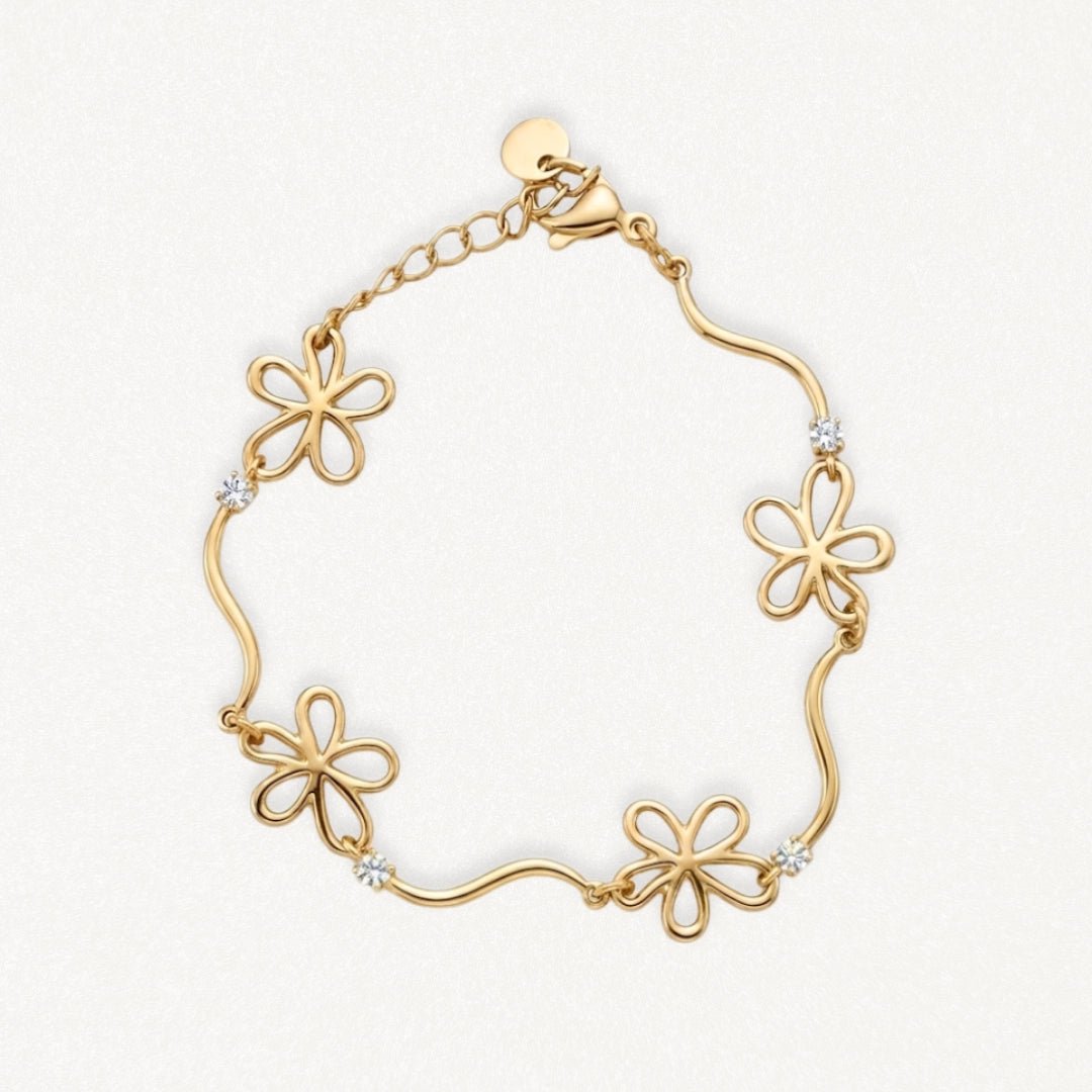 Bracelet en acier inoxydable doré avec 4 fleurs ajourées et 4 strass brillants, fermoir mousqueton.