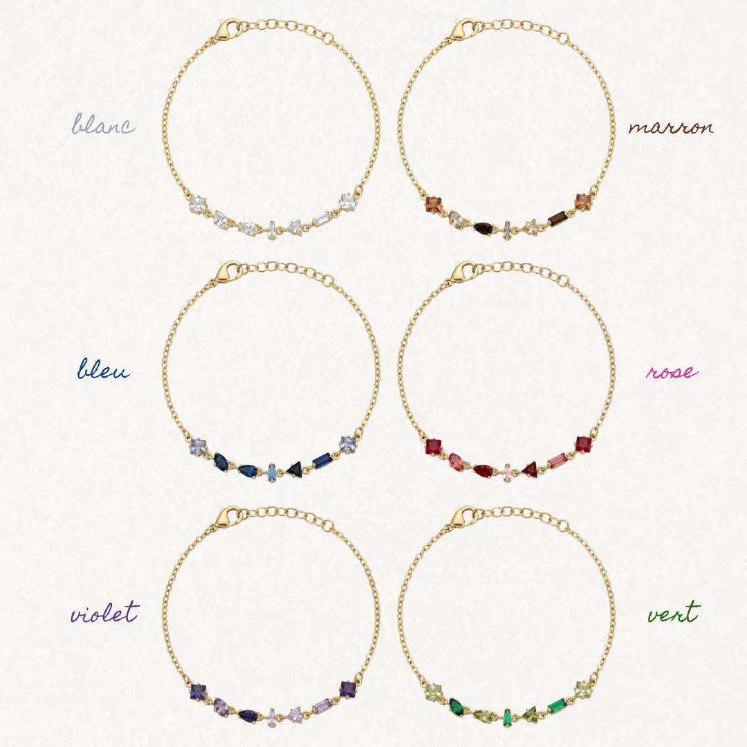 Six bracelets Blair en acier inoxydable doré avec des strass en zirconium de différentes couleurs disposés en ligne