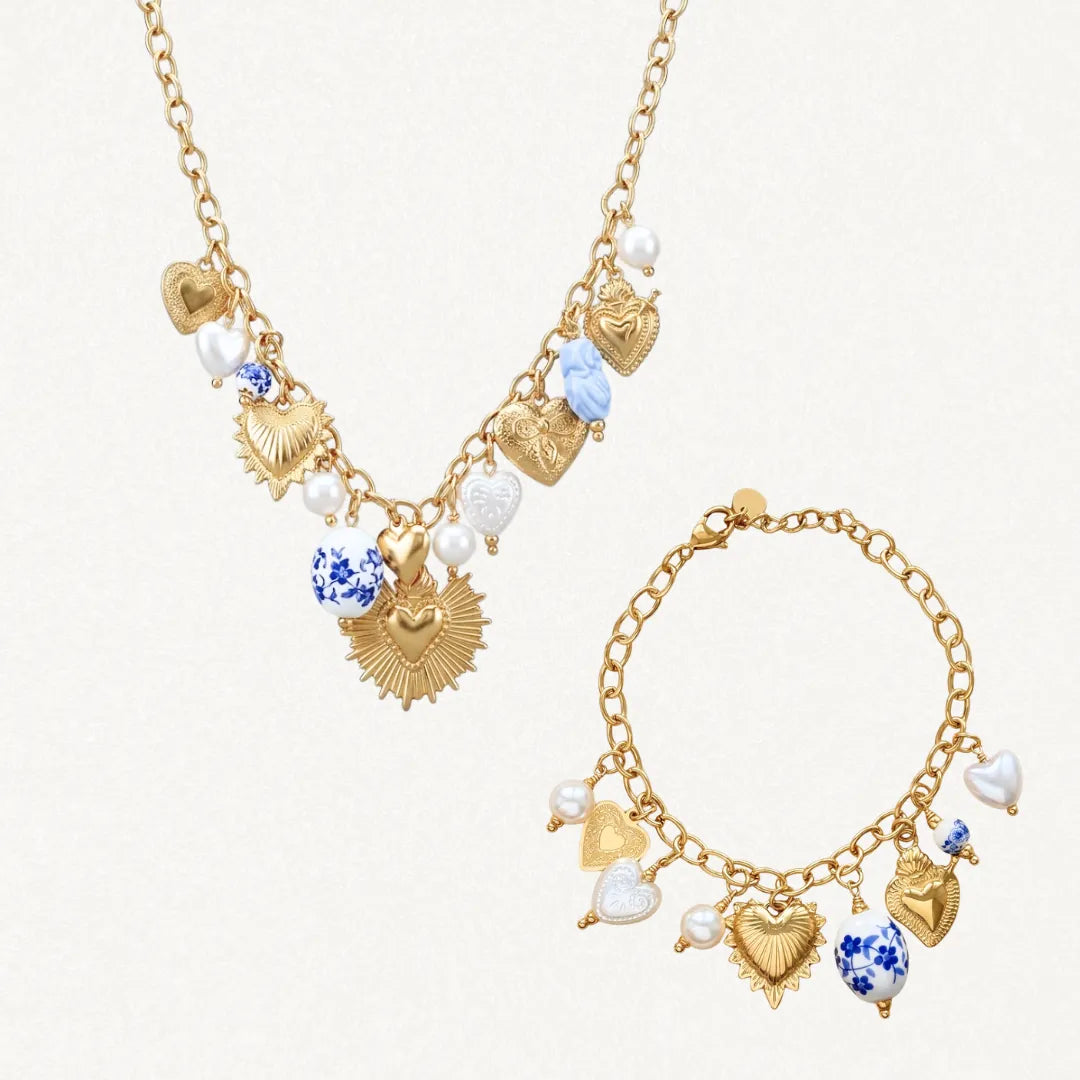 Coffret Paula compose d'un collier et d'un bracelet en acier inoxydable dore avec breloques cœurs et perles