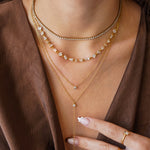 Collier Blair en acier inoxydable doré composé de plusieurs chaînes fines ornées de strass en zirconium