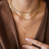Collier Blair en acier inoxydable doré composé de plusieurs chaînes fines ornées de strass en zirconium