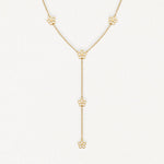 Collier acier inoxydable doré, motif 6 fleurs ajourées sur chaîne fine, style pendentif Y.