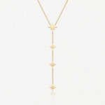 Collier lariat en acier inoxydable doré avec 4 étoiles pendentives le long de la chaîne.