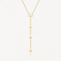 Collier lariat en acier inoxydable doré avec 4 étoiles pendentives le long de la chaîne.