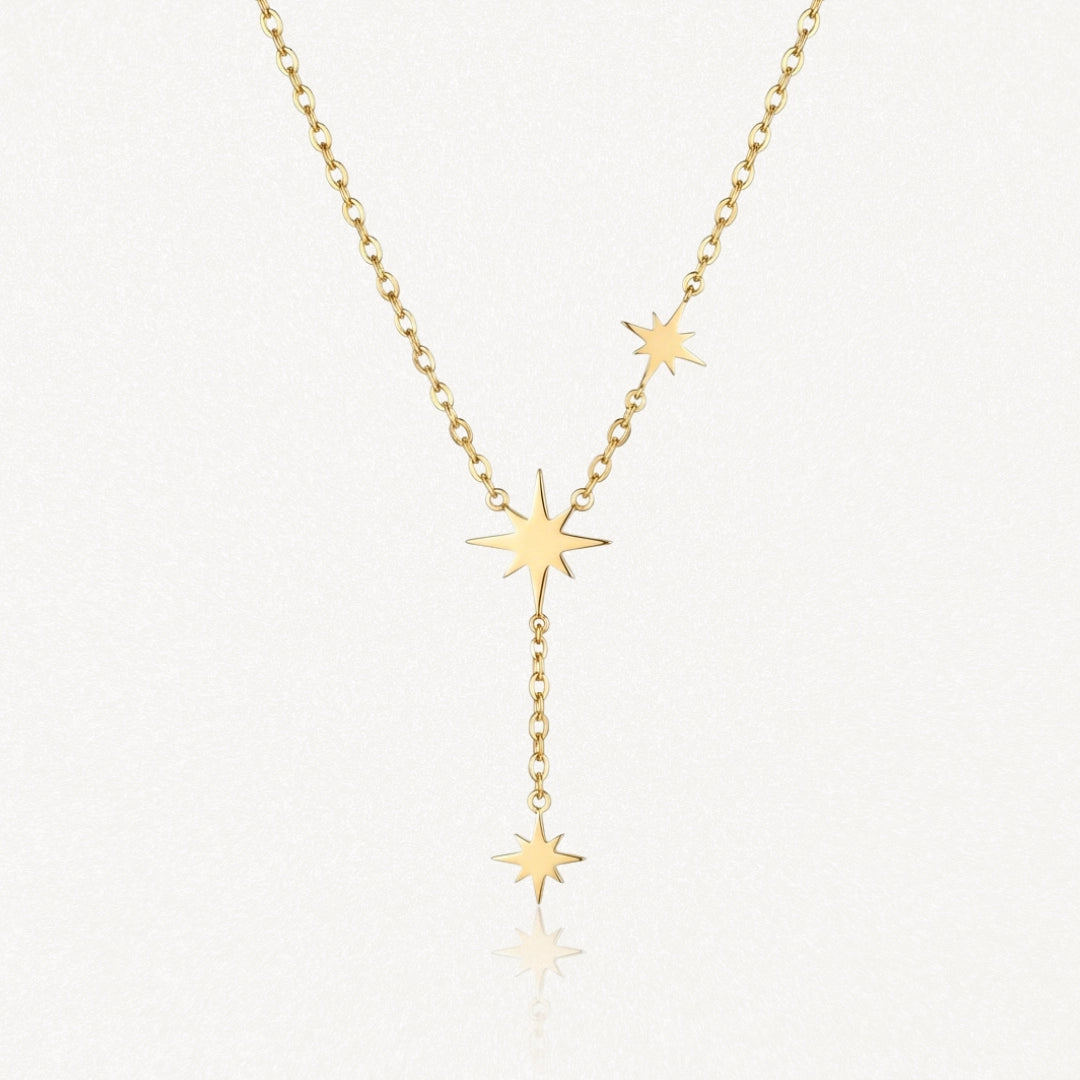 Collier en acier inoxydable doré, forme Y, avec 3 étoiles à 8 branches, dont une en pendentif.