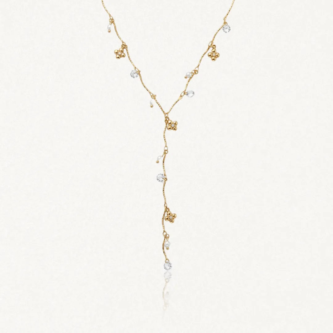 Collier en Y en acier inoxydable doré, avec breloques fleurs, perles blanches et strass brillants.