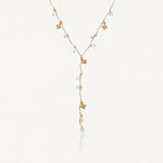 Collier en Y en acier inoxydable doré, avec breloques fleurs, perles blanches et strass brillants.