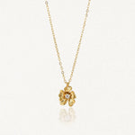 Collier en acier inoxydable doré avec pendentif fleur texturé et un centre éclatant.