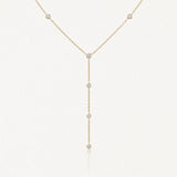 Collier lariat en acier inoxydable doré, chaîne fine ornée de 7 pierres rondes brillantes.